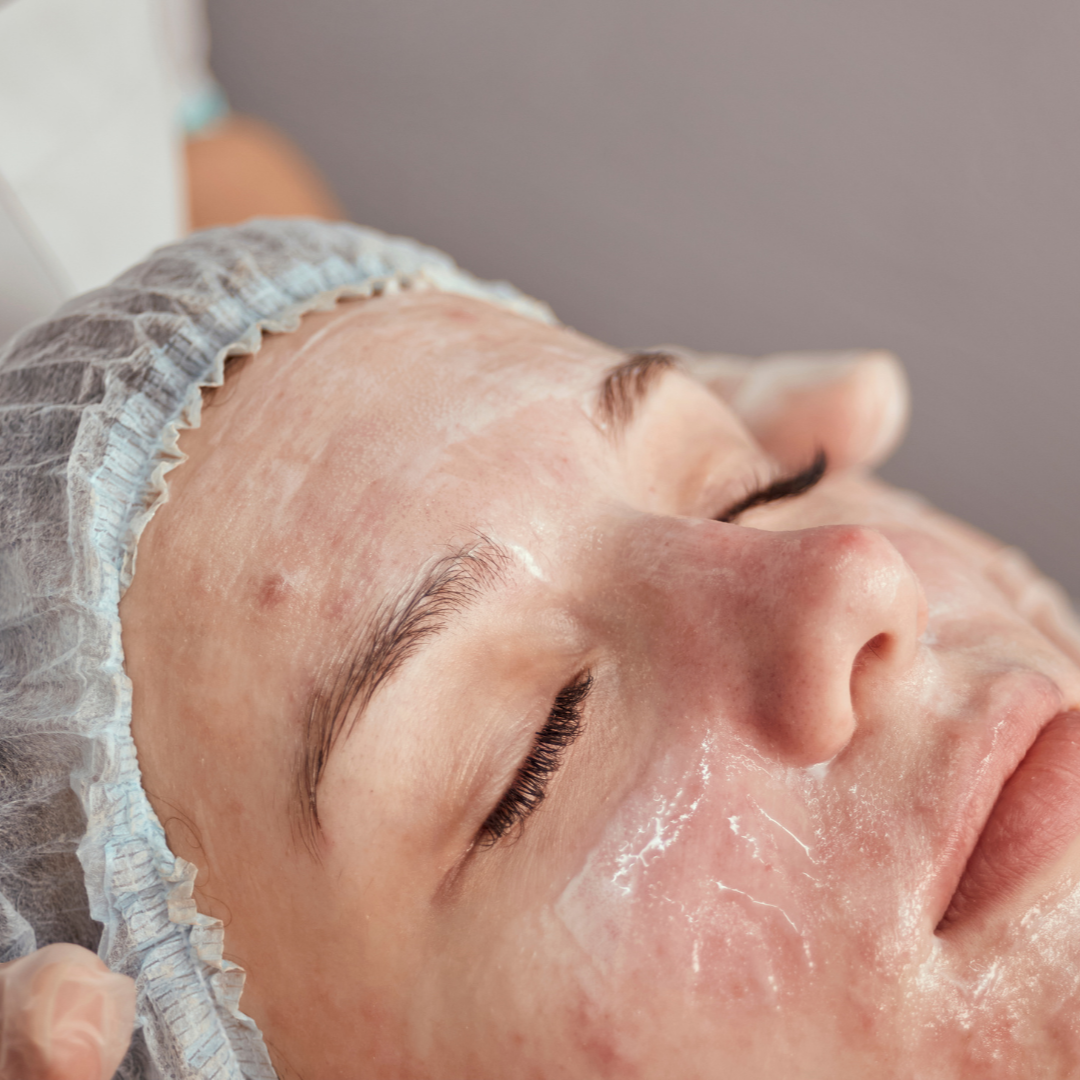 Person receiving a facial treatment with a focus on the face.