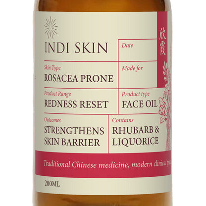 Close-up of the Redness Reset Face Oil label: rosacea prone, strengthens skin barrier